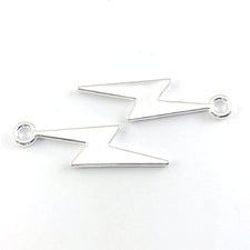 silver colour jewerly charms shaped like a lighting bolt
