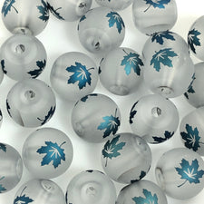 round gray beads with blue maple leafs on them