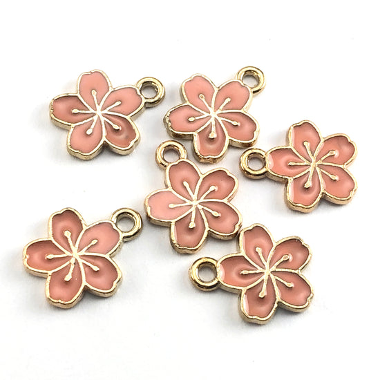 pink and gold flower shaped jewelry charms