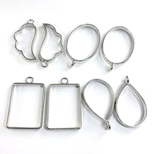 open back silver bezels in the shapes of rectangle, oval, drop and wing