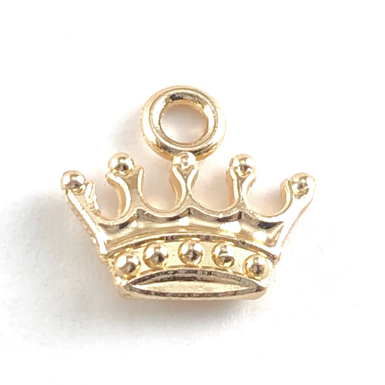 light gold coloured jewelry pendant charm shaped like a crown