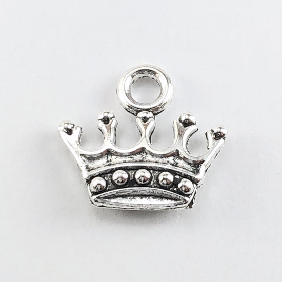 silver colour jewerly pendant charm in the shape of a crown