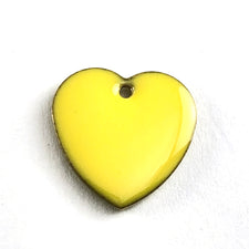 close up of yellow heart shaped jewerly pendant charms