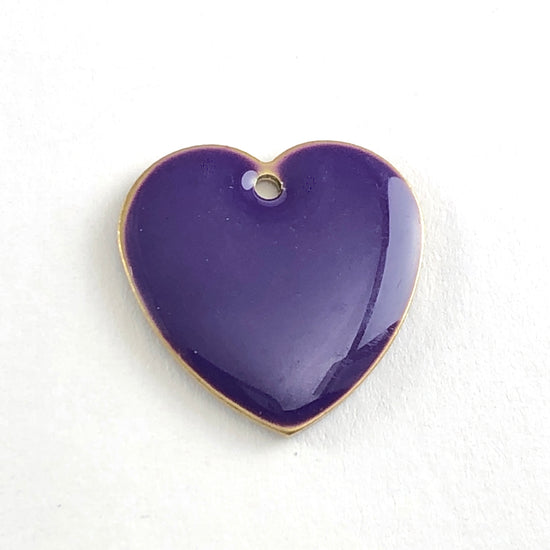 close up of purple heart shaped jewerly pendant charms
