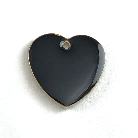Close up of black heart shaped jewerly charm