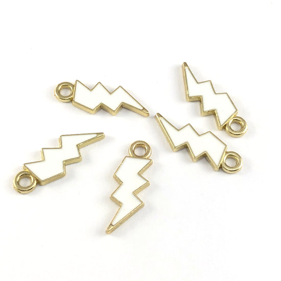 Five lightning shaped white and gold jewelry pendant charms