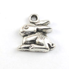 silver colour jewelry charms that look like bunny rabbits