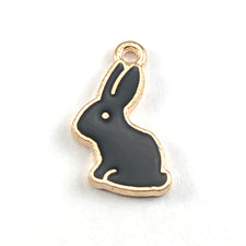 black and gold colour jewelry charms shaped like bunnies