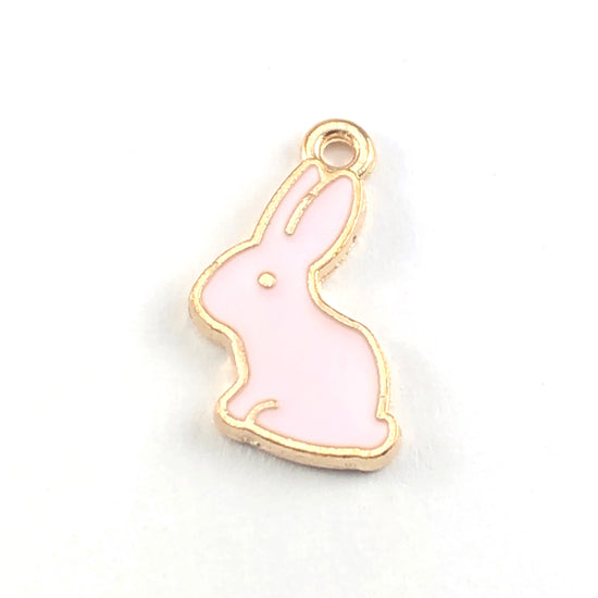 pink and gold colour jewelry charms shaped like bunnies
