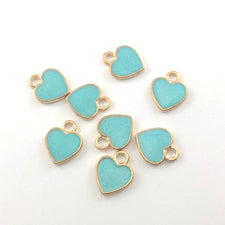 Eight blue and gold heart shaped jewelry charms