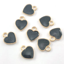eight black and gold heart shaped jewelry charms