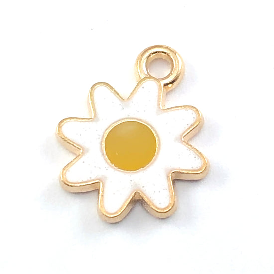 sunflower shaped charms that are white and orange colour