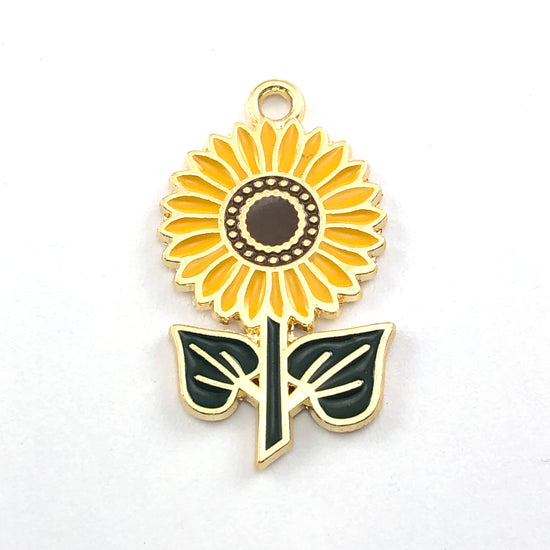 yellow, brown, green, and gold jewelry charms that look like sunflowers