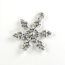snowflake shaped antique silver jewelry charm