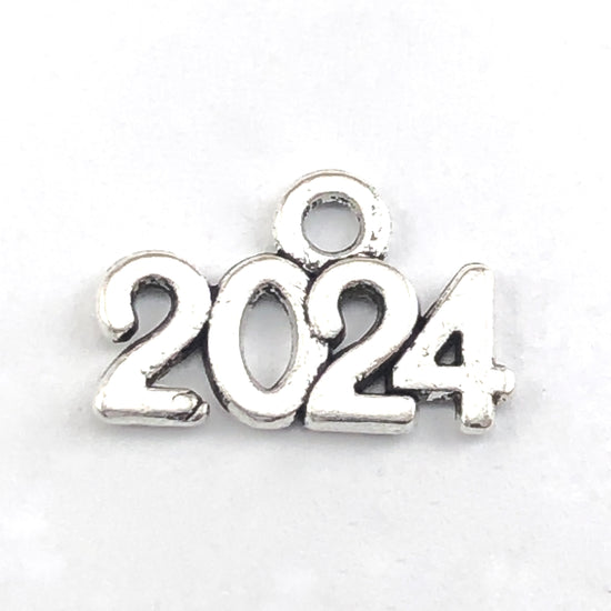antique silver jewerly charms shaped to read 2024