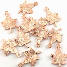 Ten rose gold colour maple leaf shaped jewelry charms
