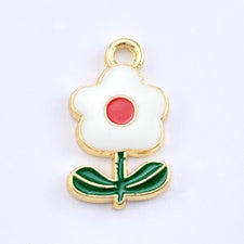 white, gold, green and red flower shaped jewerly charms