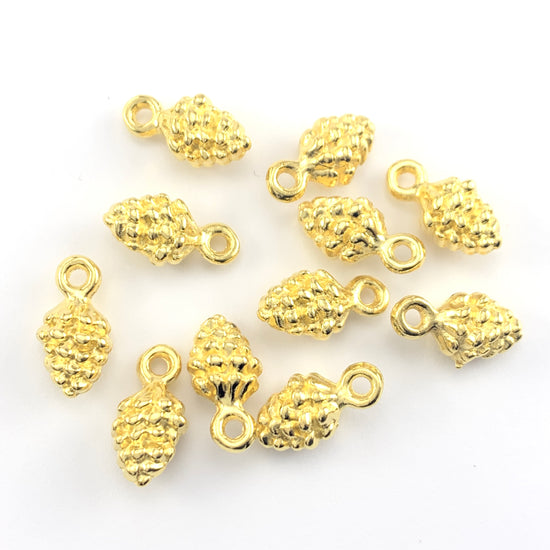 Ten pine cone shaped gold colour jewelry charms