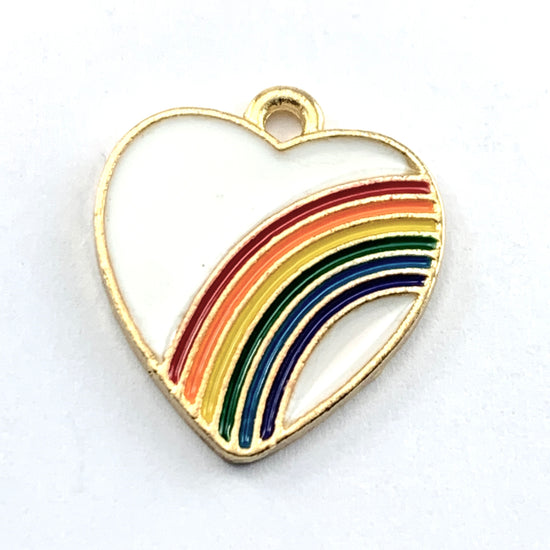 white and gold colour heart jewelry charm with a rainbow across it