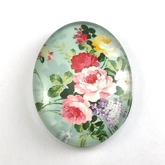 oval glass cabochon with flower design