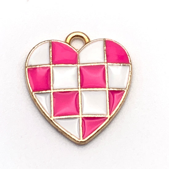 heart shaped jewelry charm with a pink and white checkered pattern
