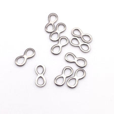Ten infinity shaped connector charms in a silver colour