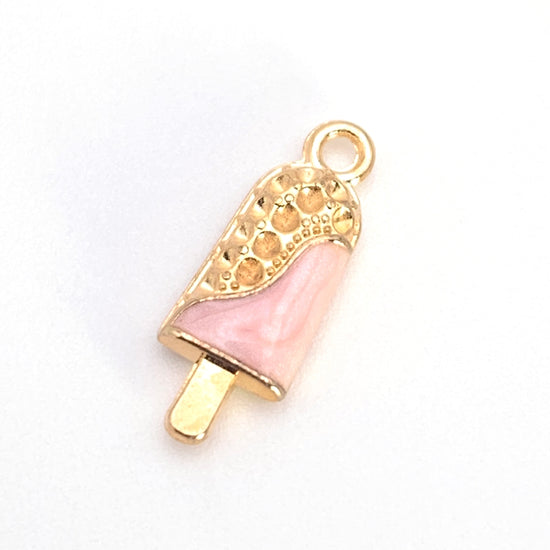 gold and pink jewelry charm that looks like an ice cream bar