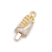 white and gold jewelry charms that look like ice cream bars