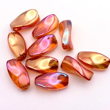 Orange colour twisted shaped jewelry beads with a rainbow AB finish
