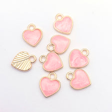 pink and gold heart shaped jewerly charms