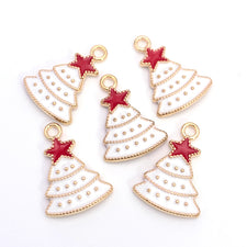 Five christmas tree shaped jewelry charms that are white, red and gold in colour