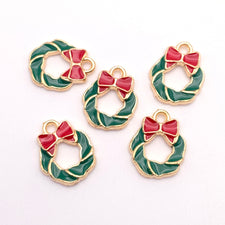 Five wreath shaped red green and gold jewelry charms