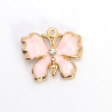 pink and gold butterfly shaped jewerly pendant
