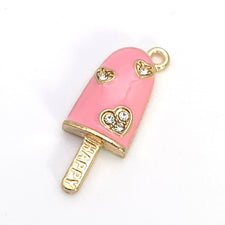 pink and gold jewerly charms shaped like ice cream bars