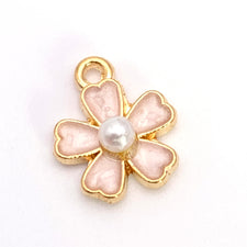 pink and gold flower shaped jewerly charm