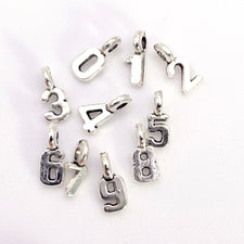 silver jewerly charms that are numbers 0, 1, 2, 3, 4 ,5, 6, 7, 8 , 9