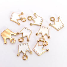 white and gold crown shaped jewelry charms
