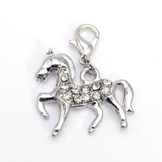 hose shaped jewelry charms that are silver with clear rhinestones, hooked to a lobster clasp