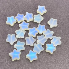 star shaped jewerly beads that are frosted white with ab coating