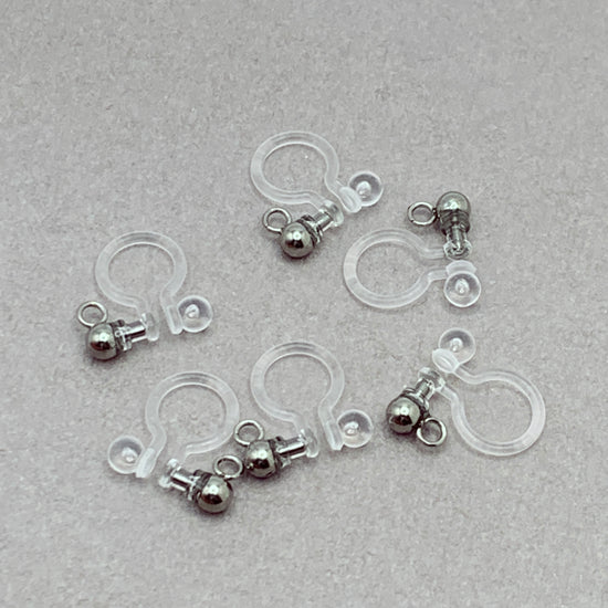 clear and silver clip on earring findings