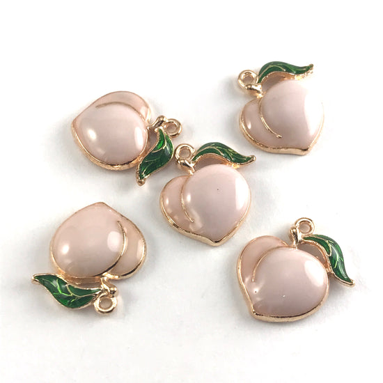enamel peach shaped jewelry charms that are pink green and gold