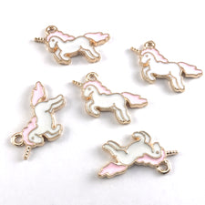 pink and white unicorn shaped charms