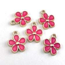 bright pink and gold flower shaped jewelry charms