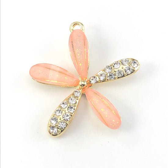 pink and gold flower shaped pendant