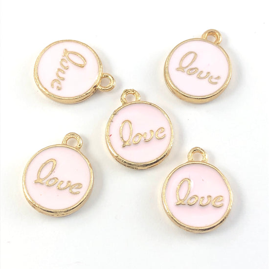 pink and gold colour round jewerly charms that have the word love on them