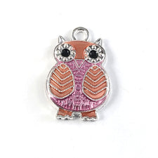 silver orange and pink jewerly charms that look like owls
