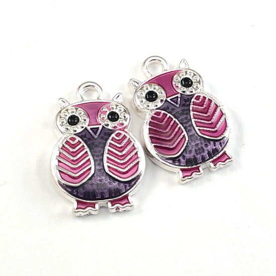 silver, purple and pink jewelry charms that look like owls
