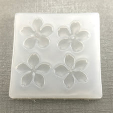 clear silicone mold with 4 flower shapes