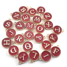 Red and gold round letter charms