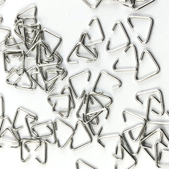 Silver colour triangle shaped jump rings
